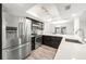 Modern kitchen with stainless steel appliances and white quartz countertops at 8133 Citrus Chase Dr, Orlando, FL 32836