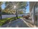 Backyard patio with seating area under a large oak tree at 856 La Gran Via Lane, Apopka, FL 32703