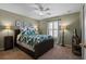 Bedroom with leafy bedding, window with shutters, and ceiling fan at 856 La Gran Via Lane, Apopka, FL 32703