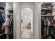 Shared closet with shelving and hanging space between bedrooms at 856 La Gran Via Lane, Apopka, FL 32703