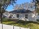 House back view showcasing patio and fenced backyard at 856 La Gran Via Lane, Apopka, FL 32703