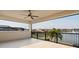 Screened balcony overlooking a lake with a water fountain at 10631 Royal Cypress Way, Orlando, FL 32836