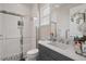 Modern bathroom with a walk-in shower and gray vanity at 10631 Royal Cypress Way, Orlando, FL 32836