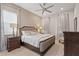 Spacious bedroom with a king-size bed and dark wood dresser at 10631 Royal Cypress Way, Orlando, FL 32836