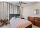 Charming bedroom with a double bed and wooden dresser at 10631 Royal Cypress Way, Orlando, FL 32836