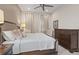 Spacious bedroom with a king-size bed and dark wood dresser at 10631 Royal Cypress Way, Orlando, FL 32836