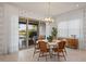 Breakfast nook with a round table and wicker chairs at 10631 Royal Cypress Way, Orlando, FL 32836