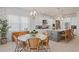 Kitchen dining area with round table and wicker chairs at 10631 Royal Cypress Way, Orlando, FL 32836