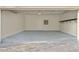 Clean and spacious garage with epoxy flooring and storage at 10631 Royal Cypress Way, Orlando, FL 32836