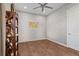 Home office with wood flooring and white brick wall at 10631 Royal Cypress Way, Orlando, FL 32836