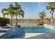 Stunning pool area overlooking a lake at 10631 Royal Cypress Way, Orlando, FL 32836