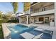 Modern pool and patio with lounge chairs and home view at 10631 Royal Cypress Way, Orlando, FL 32836