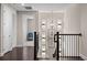 Bright upstairs hallway with modern light fixtures at 10631 Royal Cypress Way, Orlando, FL 32836