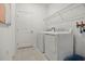 Convenient laundry room with washer, dryer, and shelving at 1216 White Ash Loop, Deland, FL 32720