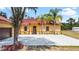 House front view, featuring a red tile roof and attached garage at 13305 Lacebark Pine Rd, Orlando, FL 32832