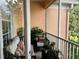 Screened balcony with seating area and lush plants at 13536 Turtle Marsh Loop # 538, Orlando, FL 32837