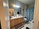 Bathroom with double vanity, shower, and toilet at 13536 Turtle Marsh Loop # 538, Orlando, FL 32837