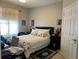 Second bedroom with a double bed and access to a window at 13536 Turtle Marsh Loop # 538, Orlando, FL 32837