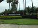 Community sign with Hunter's Creek signage, with palm trees in the background and manicured landscaping at 13536 Turtle Marsh Loop # 538, Orlando, FL 32837