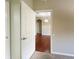 Hallway view showcasing hardwood floors and an archway with a light fixture at 13536 Turtle Marsh Loop # 538, Orlando, FL 32837