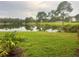 Landscaped lawn with lake view at 13536 Turtle Marsh Loop # 538, Orlando, FL 32837