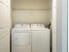 A compact laundry room with a side-by-side washer and dryer unit at 13536 Turtle Marsh Loop # 538, Orlando, FL 32837