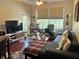 Comfortable living room with sectional sofa and TV at 13536 Turtle Marsh Loop # 538, Orlando, FL 32837