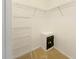 Walk-in closet providing ample storage space with wire shelving and personal safe at 13536 Turtle Marsh Loop # 538, Orlando, FL 32837