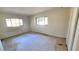 Spacious bedroom with two windows and tile flooring at 1416 Wilton Ave, Orlando, FL 32805