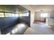 Bright dining area with large windows and dark gray walls at 1416 Wilton Ave, Orlando, FL 32805