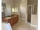 Primary bathroom with double sinks, soaking tub and shower at 14515 Huntcliff Park Way, Orlando, FL 32824