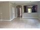 Open dining room with tile floors and kitchen views at 14515 Huntcliff Park Way, Orlando, FL 32824