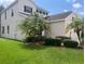 Two-story house with a well-maintained lawn at 14515 Huntcliff Park Way, Orlando, FL 32824