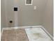 Clean laundry room with space for washer and dryer at 14515 Huntcliff Park Way, Orlando, FL 32824