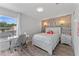 Bedroom with wood-look wall, queen bed, and home office space at 14742 Masthead Landing Cir, Winter Garden, FL 34787