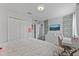 Bedroom with a desk, full bed, and leafy wall decor at 14742 Masthead Landing Cir, Winter Garden, FL 34787