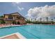 Large community pool with adjacent clubhouse at 14742 Masthead Landing Cir, Winter Garden, FL 34787