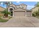 Two-story house with a large driveway and landscaped front yard at 14742 Masthead Landing Cir, Winter Garden, FL 34787