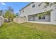 Backyard view of the house and fenced area at 1479 Brookdale Ct, Oviedo, FL 32765