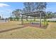 Community pergola with blue bench and landscaping at 1479 Brookdale Ct, Oviedo, FL 32765