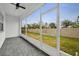 Screened porch with paver floor and backyard view at 1479 Brookdale Ct, Oviedo, FL 32765