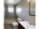 Updated bathroom with tile flooring and a tub shower combo at 14912 Sw 35Th Cir, Ocala, FL 34473