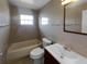 Clean bathroom with a tub, toilet, and updated vanity at 14912 Sw 35Th Cir, Ocala, FL 34473