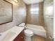 Tiled bathroom with shower-tub combination and vanity at 14912 Sw 35Th Cir, Ocala, FL 34473