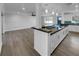 Bright, open-concept kitchen with modern island and bar seating at 14912 Sw 35Th Cir, Ocala, FL 34473