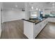 Modern kitchen with island and white shaker cabinets at 14912 Sw 35Th Cir, Ocala, FL 34473