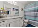 Clean bathroom with striped shower curtain and modern vanity at 161 Mandovi St, Davenport, FL 33837