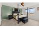 Spacious bedroom with a post bed and ceiling fan at 161 Mandovi St, Davenport, FL 33837