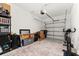 Garage with storage shelving, exercise bike, and extra space at 161 Mandovi St, Davenport, FL 33837