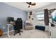 Home office featuring a standing desk, comfortable chair, and ample natural light at 161 Mandovi St, Davenport, FL 33837